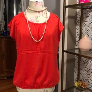 Tomato sleeveless blouse